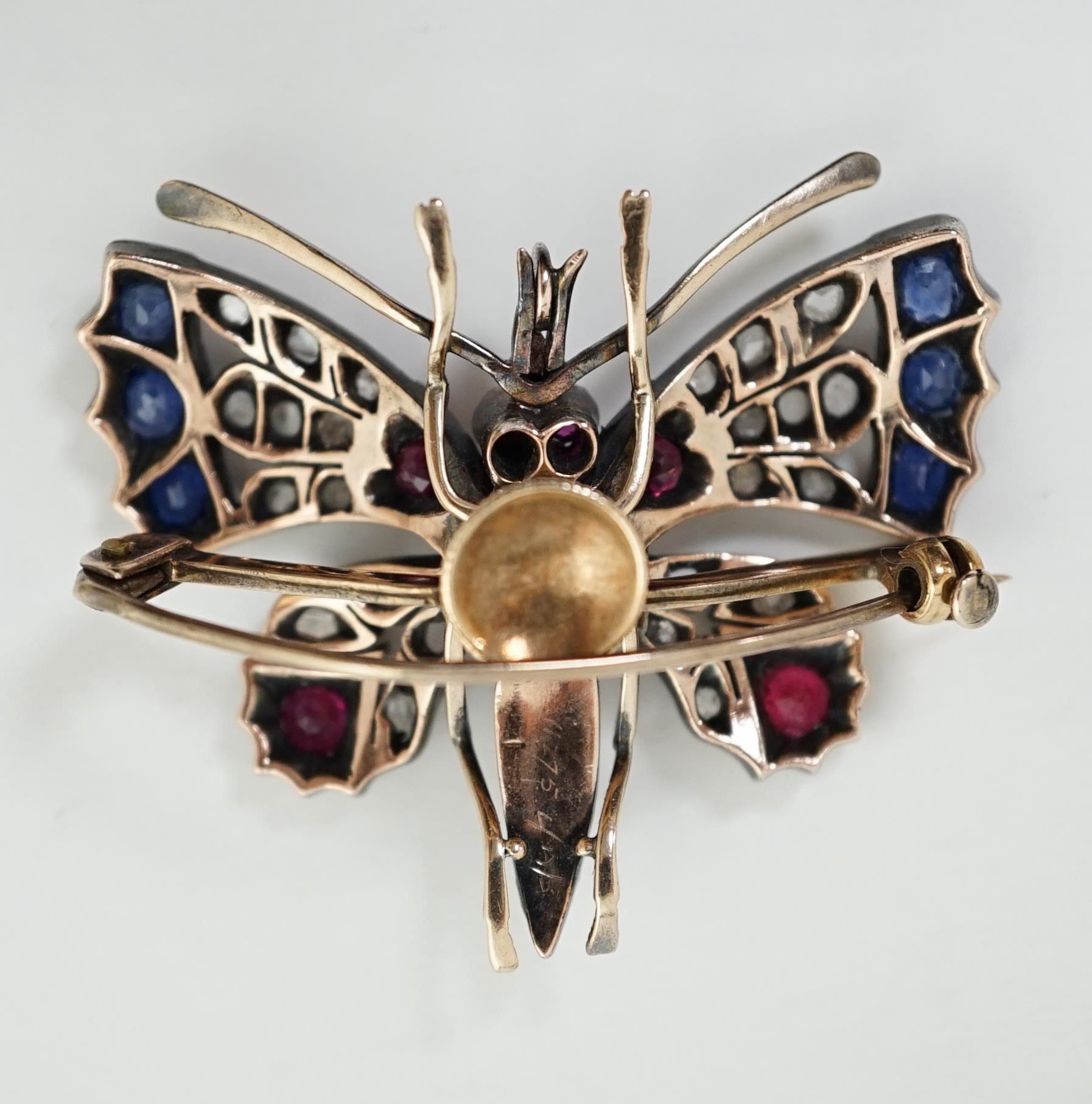 A Victorian gold, diamond, sapphire, ruby and split pearl cluster set butterfly brooch